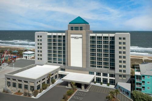 an aerial view of the omni hotel at the beach at Courtyard by Marriott Carolina Beach Oceanfront in Carolina Beach