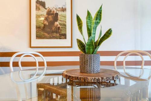 a table with two chairs and a potted plant on it at Sunset Sanctuary in Steamboat Springs