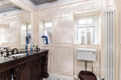 a bathroom with a sink and a toilet and a mirror at Double rooms in shared house in Bournemouth