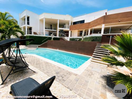 a swimming pool in front of a building at Casa RE Completa in Tehuacán