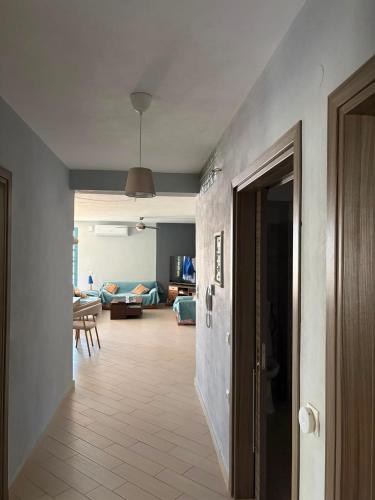 a room with a hallway with a living room at Angela Apartments in Igoumenitsa