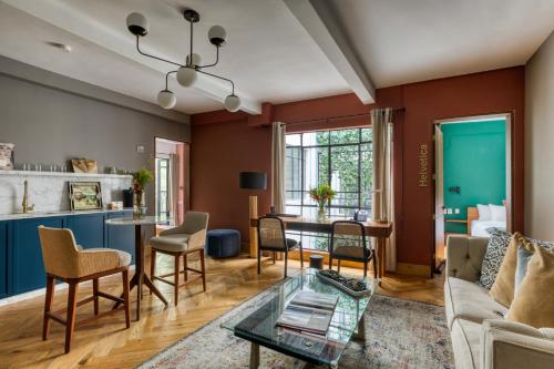 a living room with a couch and a table at Casa Altata Hotel Boutique in Mexico City
