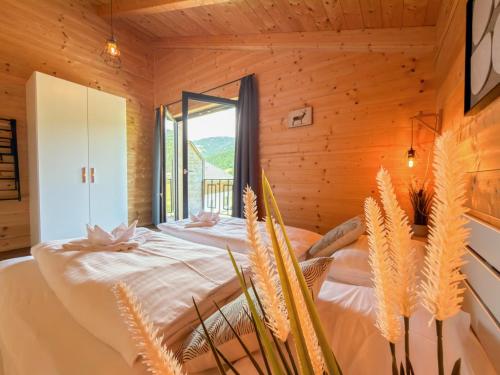 a bedroom with a bed with a window at Rattendorf 20A in Rattendorf