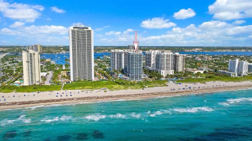 an aerial view of a beach and buildings at Amrit Resort - Bask in Rare Oceanfront Luxury with Stunning Views in Riviera Beach
