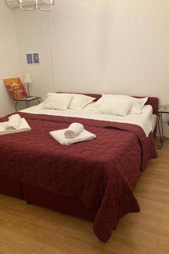 a large bed with two towels on top of it at Apartments with parking space Slatine, Ciovo - 6061 in Slatine