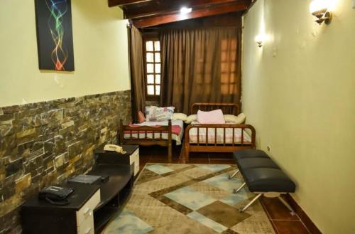 a living room with a couch and a table at Bianki vip villa in Alexandria