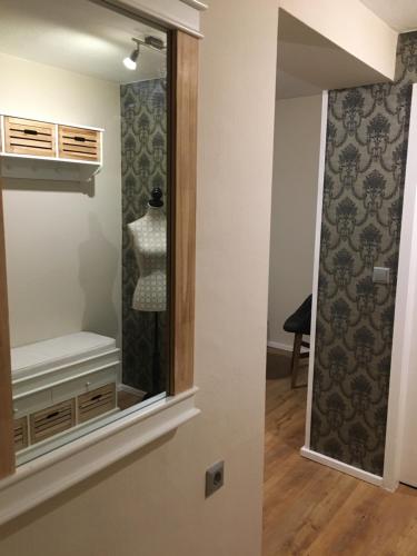 a mirror in a room with a dressing room at Pension Bergseeblick in Titisee-Neustadt