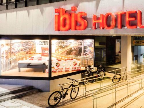 a bike is parked in front of a store at ibis Porto Centro São Bento in Porto