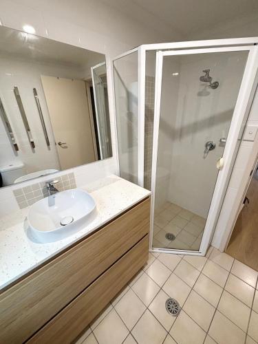 a bathroom with a sink and a shower at Jubilee Apartment 05 - Bring your own linen in South West Rocks