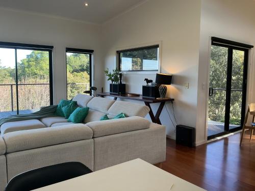 a living room with a couch and a table at Black Hill Retreat, Ballarat in Nerrina