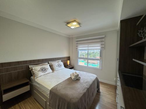 a bedroom with a bed and a window at Casa Luna in Americana