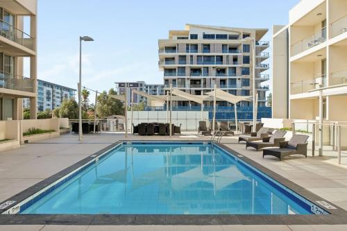 a swimming pool in the middle of a building at Quest Scarborough in Perth
