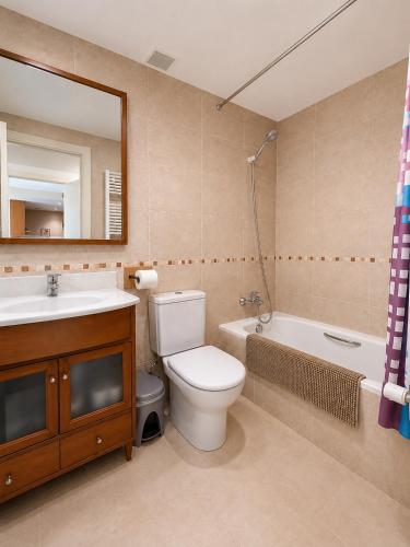 a bathroom with a toilet and a sink and a tub at Green Valley Las Margas Golf in Latas