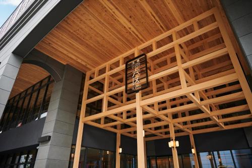 a building with a sign on the front of it at Asakusa View Hotel Annex Rokku in Tokyo
