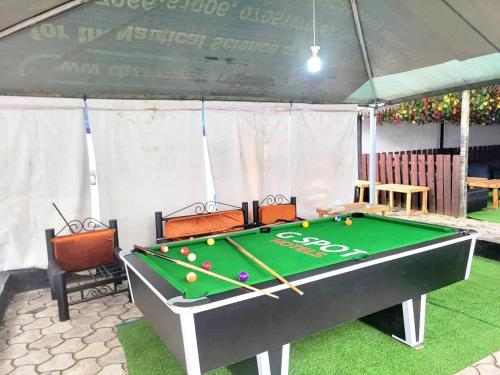 a billiard table in a tent with at G Spot Hotel in Port Harcourt