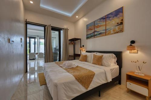 a bedroom with a large bed in a room at Nalumi Villa in Nusa Penida