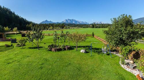 an aerial view of a field with trees and a bicycle at Gästehaus Simon in Krün