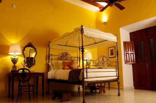 Un ou plusieurs lits dans un hébergement de l'établissement Hotel Boutique Casa Don Gustavo, Campeche