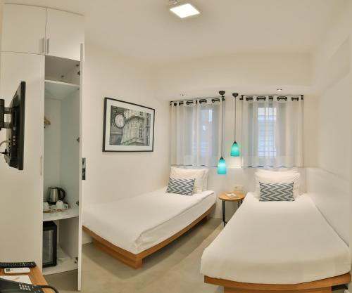 Tempat tidur dalam kamar di Alilass Hotel