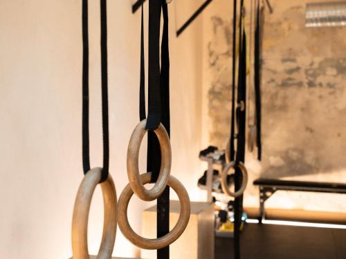 two pairs of scissors hanging on a wall at Mercure Paris Bastille Marais in Paris