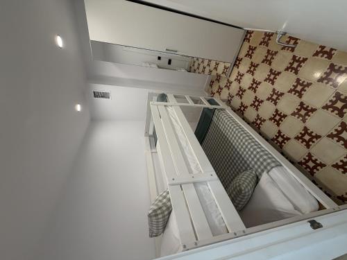 a room with a bunk bed with a ladder at Apartamentos_Lovely_Rooms_Vic in Vic