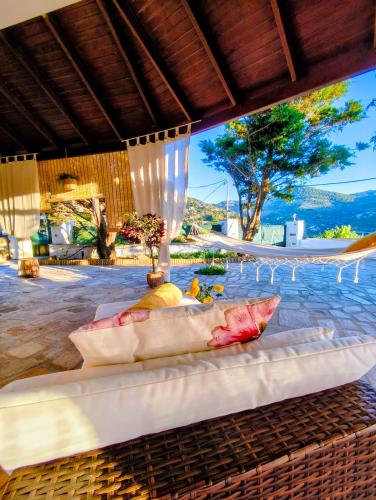 a room with a bed with a view of a pool at Joanna Studio in Akamatra