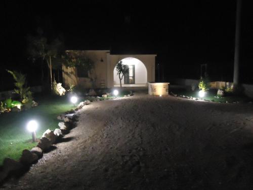 a house at night with lights in the yard at Villetta Dote in Casarano