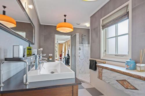 a bathroom with a sink and a large mirror at Gentle in Bolsward