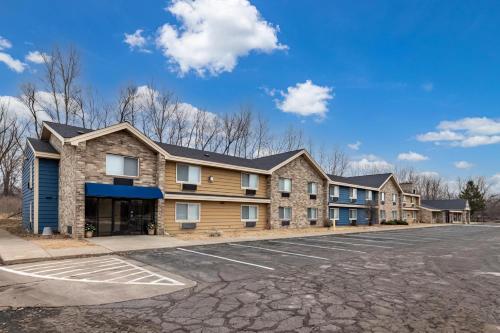 an empty parking lot in front of a building at AmericInn by Wyndham White Bear Lake St. Paul in White Bear Lake