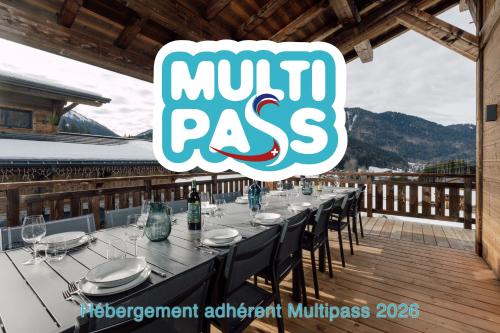 a long table on the deck of a restaurant at Chalet Imperial by Altitudia in Morzine