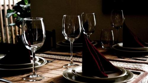 a group of wine glasses sitting on a table at Abrigo da Estrela in Covilhã