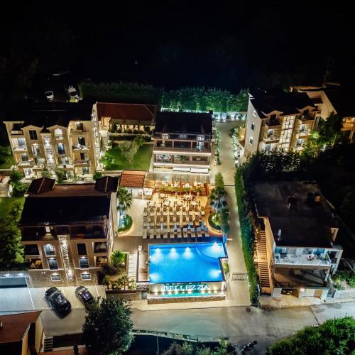 an aerial view of a resort at night at Bellezza Residence & Spa Kotor in Donji Morinj