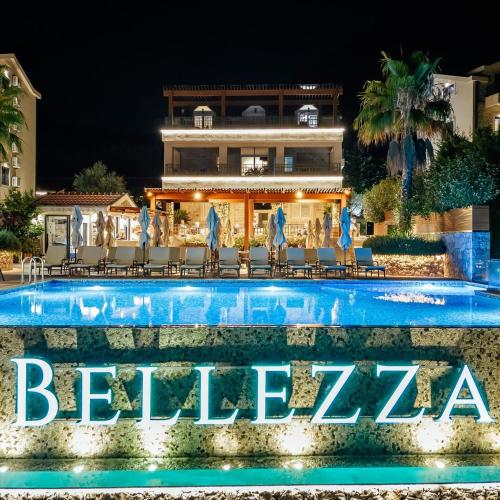 a hotel swimming pool with a sign that reads behtar at Bellezza Residence & Spa Kotor in Donji Morinj