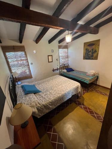 a bedroom with two beds in a room at Rest has a name: Munay in Tafí del Valle