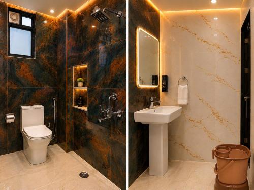 a bathroom with a toilet and a sink and a shower at Hotel SS Residency in Patna
