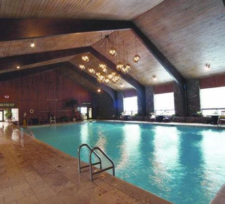 a large swimming pool in a large building at Peek'n Peak Resort Trademark Collection by Wyndham in Clymer