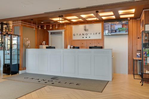 a store with a white counter in a room at GRANO LIFE Gdańsk in Gdańsk