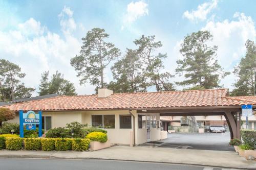 a building with a gas station at Days Inn by Wyndham Monterey-Fisherman's Wharf Aquarium in Monterey