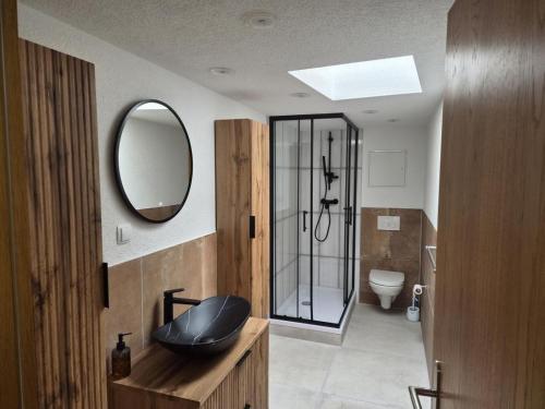 a bathroom with a sink and a mirror at NEU! Über den Dächern von Mücheln in Mücheln