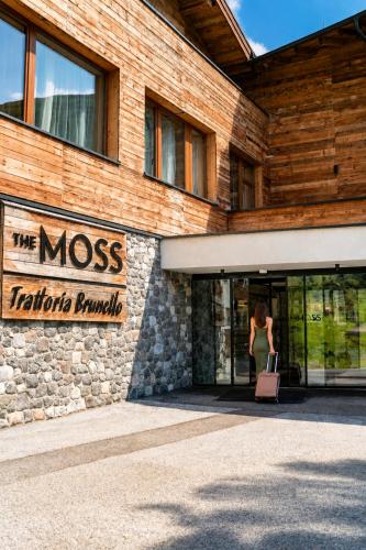 a woman walking out of the moss tatatoaraara building at The Moss - Your unique hideaway in Obergurgl
