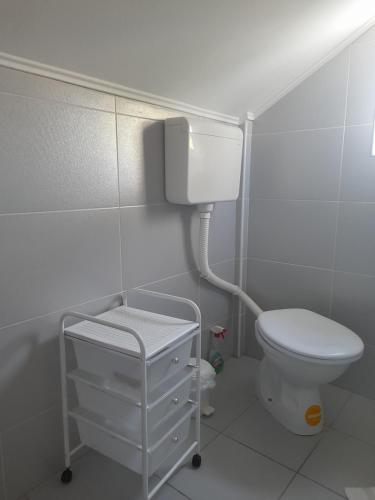 a small bathroom with a toilet and a sink at Apartmani Goga in Pirovac