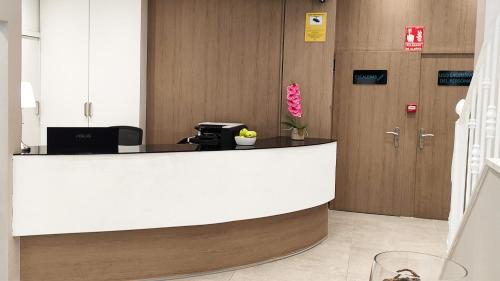 a lobby with a reception desk in a building at BLUESEA Faro Cullera in Cullera