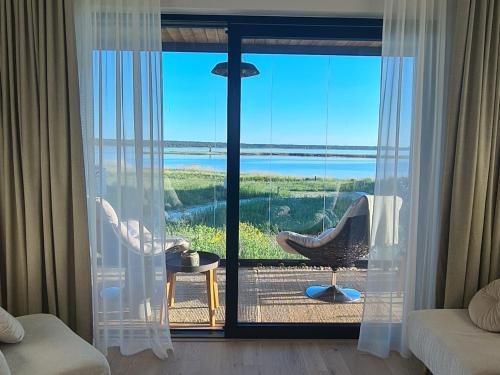 a living room with a view of the ocean at Seaside Getaway Apartment in Haapsalu
