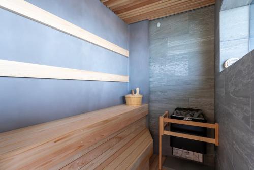 a room with a wooden shelf and a window at KONA OCEAN Club in Awaji