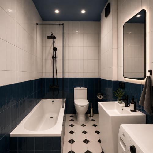 a bathroom with a tub and a toilet and a sink at Matilda Signature Apartments in Telavi
