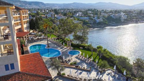 an aerial view of a hotel and the water at Thalassa Boutique Hotel & Spa in Paphos