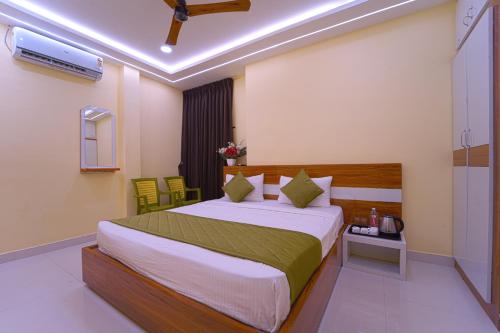 a bedroom with a large bed in a room at I&S Residency in Rāmanāthapuram