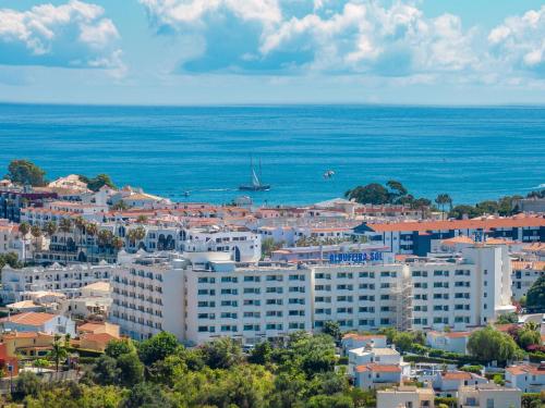 an aerial view of a city and the ocean at Albufeira Sol Hotel & Spa in Albufeira