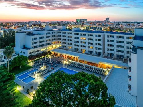 an aerial view of a hotel with a pool at Albufeira Sol Hotel & Spa in Albufeira