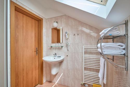a bathroom with a sink and a toilet at Penzion Aida Ostrava in Ostrava